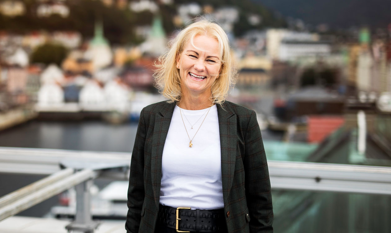 Woman stands smiling - Elna Kathrine Grieg, Board member of Grieg Group
